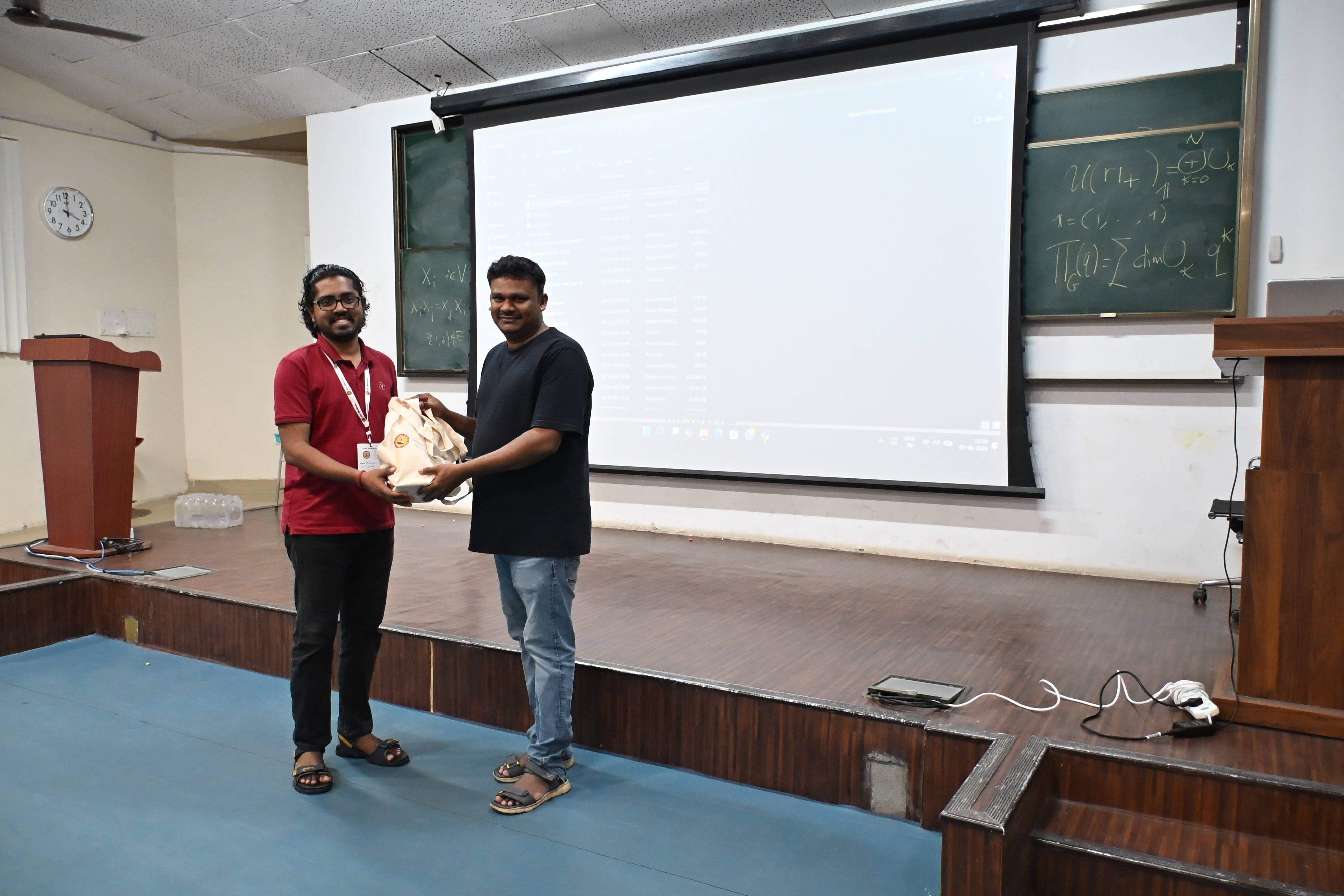 Me presenting a memento to R. Venkatesh as the chair of the session
