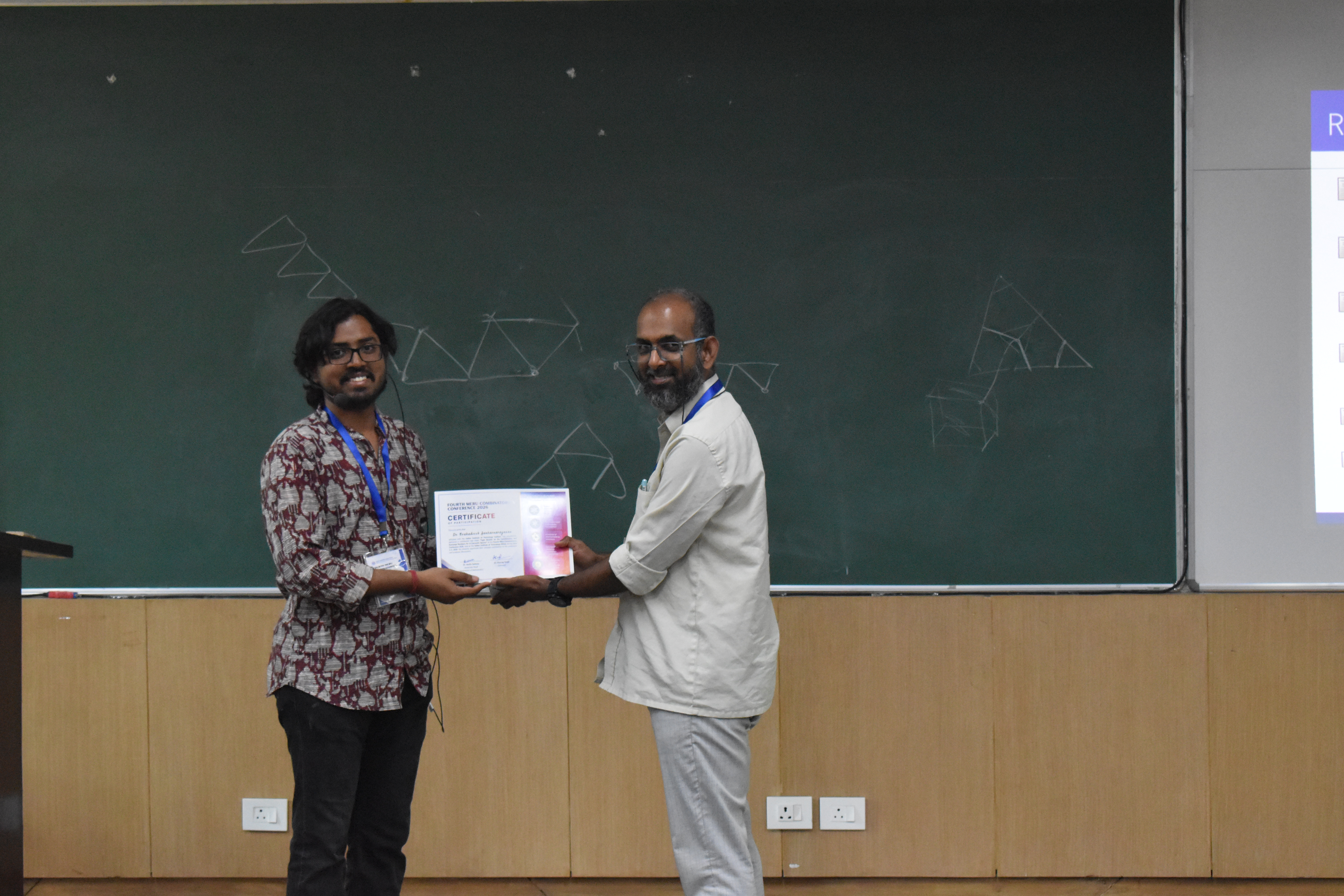 Receiving a memento from the session chair Arvind Ayyer (IISc Bangalore)